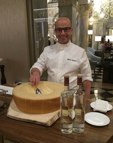 Chef Alessio Corda and the wheel of Parmigiano Reggiano. Photo © 2016 genevafamilydiaries.net 